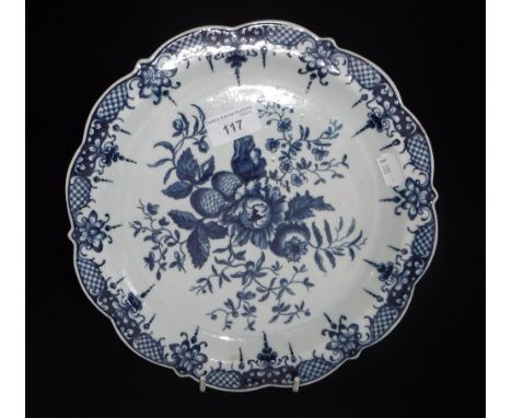 WORCESTER FIRST PERIOD: A BLUE AND WHITE PLATE with rose and pine cone decoration 10.25" dia