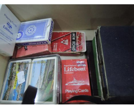 A box of assorted playing cards