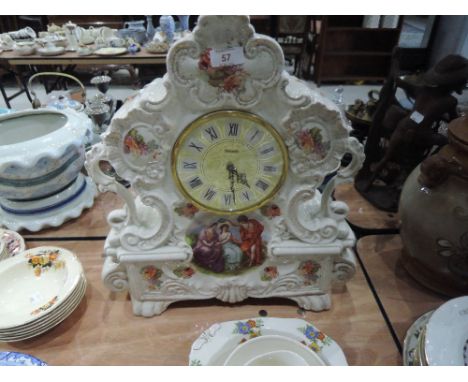 A large ornate ceramic mantle clock