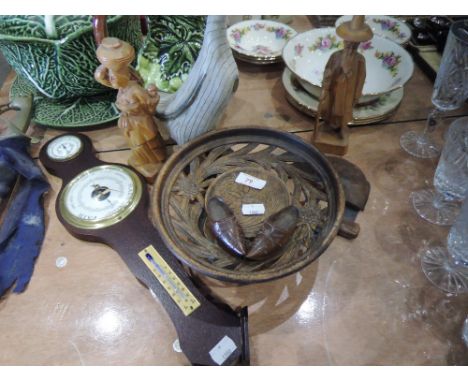 A selection of treen including musical plate, barometer, carved figures etc