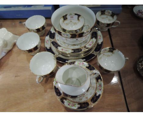 A part tea service in white with blue and floral gilt decoration (22 pieces approx)