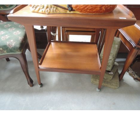 A vintage teak tea trolley