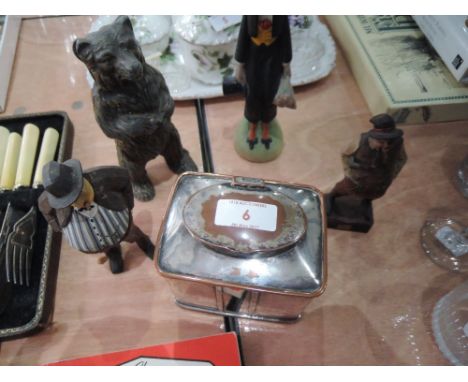 A plated tea caddy, metal bear money box and three carved treen figures