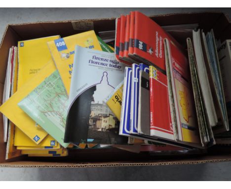 A box of vintage European road maps etc