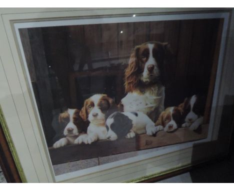 A signed limited edition print, Spaniel and puppies, after John Mould, 93/500 also oil on board woodland scene