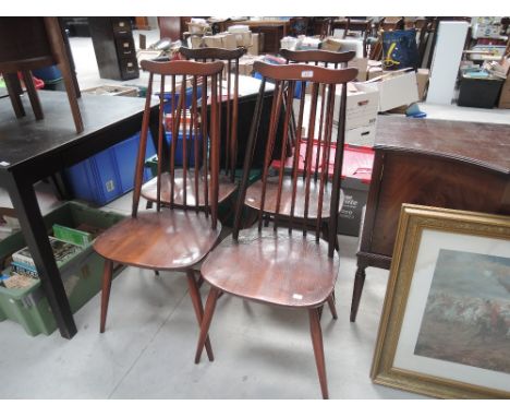 Four Ercol style dark stained spindle back dining chairs