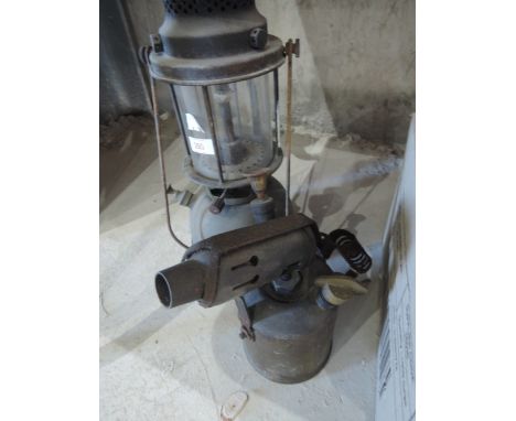 A vintage oil lamp and blow torch