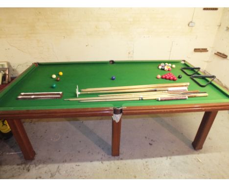 A half size single slate snooker table on six legs.  Comes with set of balls, set of pool balls, two triangles, score card, e