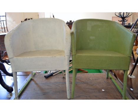 A pair of Lloyd Loom chairs and a green tin travelling trunk