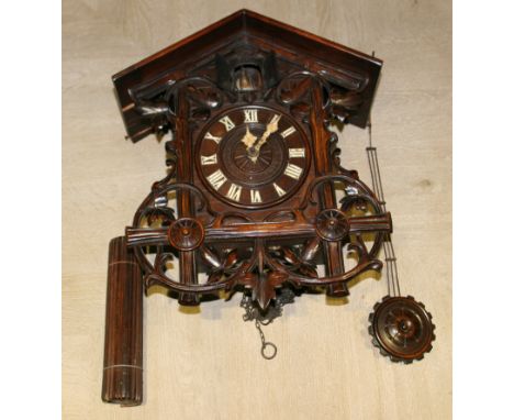 A BLACK FOREST TYPE CUCKOO CLOCK H38CM W33CM