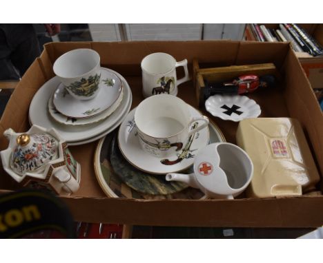 A selection of Military related decorative ceramics and ornaments including a 70cl whisky flask modelled as a jerry can, a Fe