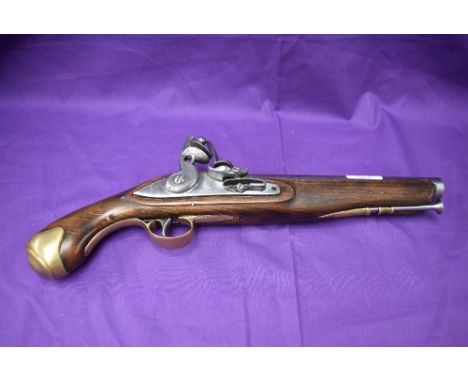 A 19th century flintlock pistol, brass mounts, ram rod, lock plate stamped Tower, Crown with GR and possibly military arrow, 