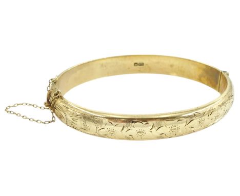 9ct gold hinged bangle, with engraved decoration, Birmingham 1976Condition Report:Approx 12.5gm, hollow interior, inner circu