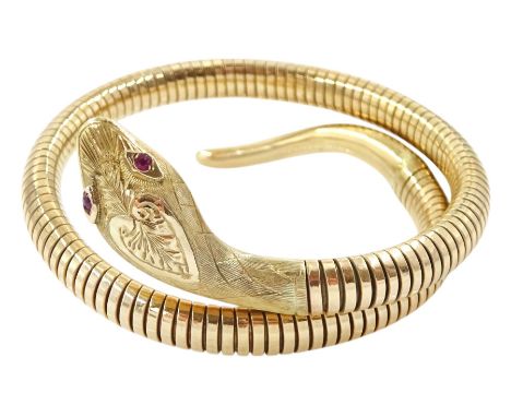9ct gold snake bangle, with ruby set eyes, Chester 1958Condition Report:Approx 21.9gm, metal core, tail end to head end = 25c