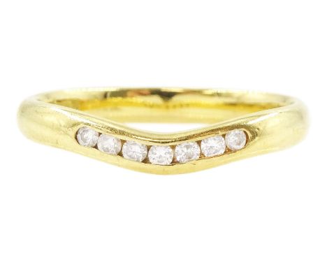 18ct gold channel set, seven stone round brilliant cut diamond wishbone ring, hallmarkedCondition Report:Approx 3.3gm, size P