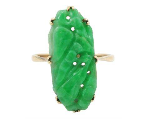 Rose gold carved jade ring, stamped 9ctCondition Report:Approx 3gm, size R-S, a couple of brown lines visible from underside 