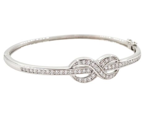 Silver cubic zirconia knot design hinged bangle, stamped 925Condition Report:Inner circumference = 18cm, good condition