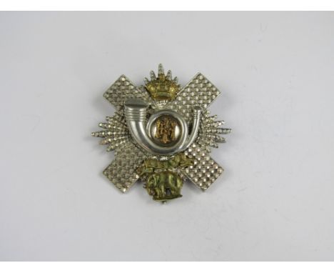 A Highland Light Infantry officer's cap badge, (tests as silver) 