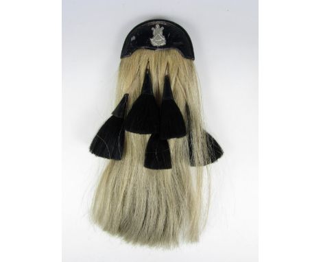A George V 9th Highland Light Infantry five-tassel sporran bearing the inscription No 5256, WM F Cranston (9th HLI) 