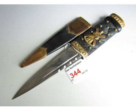 A Scottish highland regiment sgian dubh, the pommel set with a faux citrine and the hilt bearing a brass Saint Andrew and sal