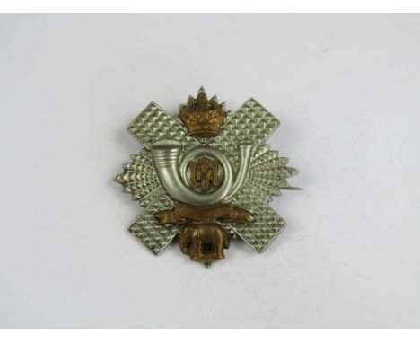 A Highland Light Infantry Territorial officer's cap badge 