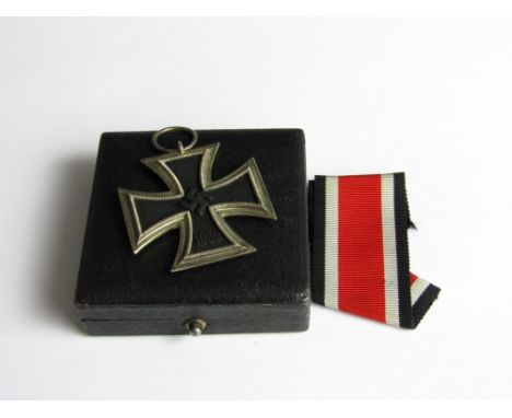 A 1939 Iron Cross Second Class together with a case for an Iron Cross First Class or similar 
