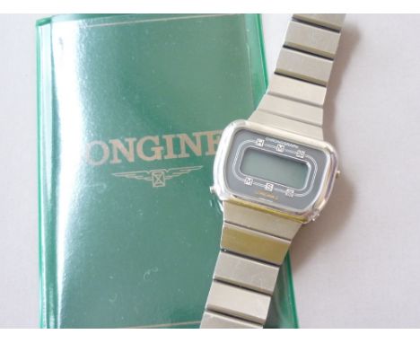 A 1970s gentleman's Longines stainless steel digital wrist watch, together with documents 