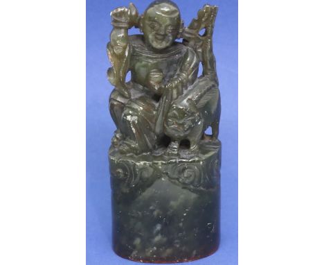 Green jade large seal featuring a seated man and a dog, H: 112 mm. P&amp;P Group 1 (£14+VAT for the first lot and £1+VAT for 