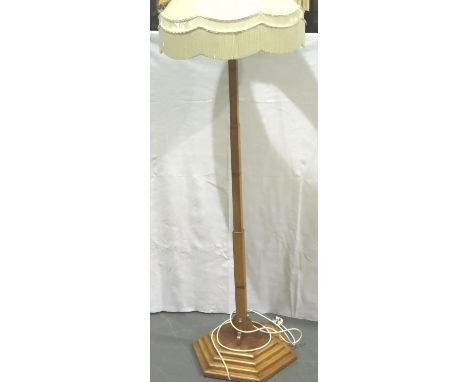 An Art Deco inlaid maple standard lamp raised on a stepped hexagonal base, H: 190 cm including shade. Not available for in-ho
