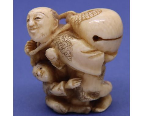 Ivory carved netsuke in the form of a man carrying a basket with a child at his feet, H: 40 mm. signed to base. P&amp;P Group