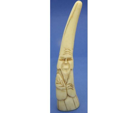 Ivory carved netsuke in the form of a tusk shaped man, H: 98 mm, unsigned. P&amp;P Group 1 (£14+VAT for the first lot and £1+