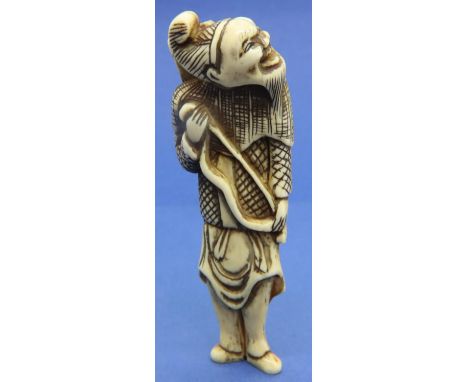 Ivory carved netsuke in the form of an archer with a quiver of arrows, H: 82 mm, unsigned. Some age related cracks. P&amp;P G