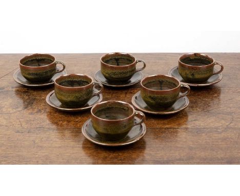 Set of six teacups and saucers Studio pottery, with iron glaze, unmarked, saucer 13.5cm across, teacup 6.5cm high (12)Note: T