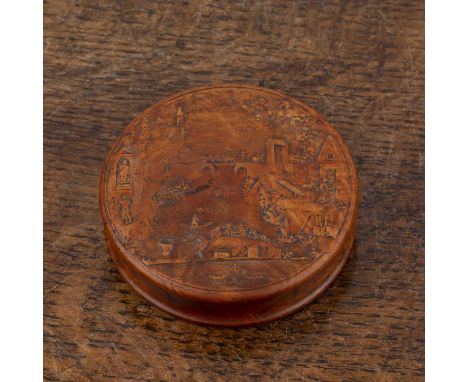 Treen circular snuff box Late 18th/early 19th Century, with tortoiseshell lining, the lid decorated with a carved riverside s