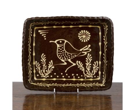 Paul Young (b.1961)Studio pottery baking dish, with slip glazed decoration of a bird, unsigned, 30cm wide x 5.5cm high x 25cm