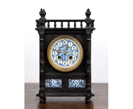 Aesthetic movement mantel clock In an ebonised case with turned details, the decorative blue enamel dial with Arabic numerals