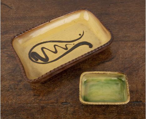 Chris Harries (1901-1971) at Winchcombe potteryTwo pottery dishes, the larger slip glazed example with incised pie crust rim,