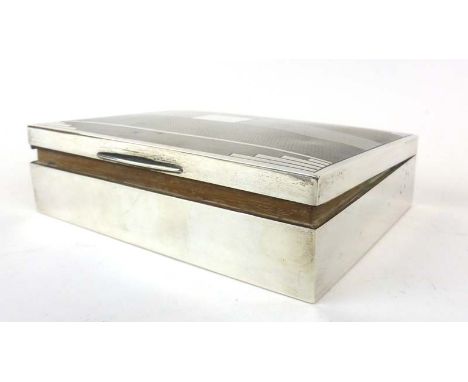 A silver and engine turned cigarette box of plain rectangular form, Birmingham 1946, w. 16.5 cm   CONDITION REPORT:  Dents an