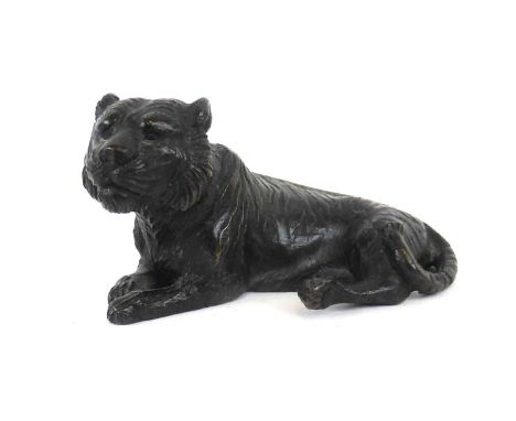 A Meiji brown patinated bronze figure modelled as a resting tiger, signed, h. 4 cm CONDITION REPORT: Some wear 