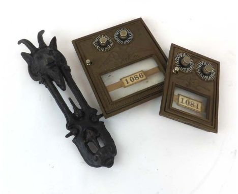 Two US brass Post Office door locks together with a cast metal door knocker