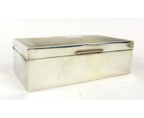 A silver engine turned cigarette box of rectangular form, maker JR, Birmingham 1971, w. 16.5 cm, together with a cigar and a 