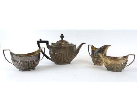 An Edwardian silver three piece tea service of vase shaped form with gadrooned decoration, maker R&B, Sheffield 1906, 32 ozs,