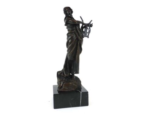 A 20th century bronze figure modelled as a woman playing a harp, on a marble plinth, h. 36 cm