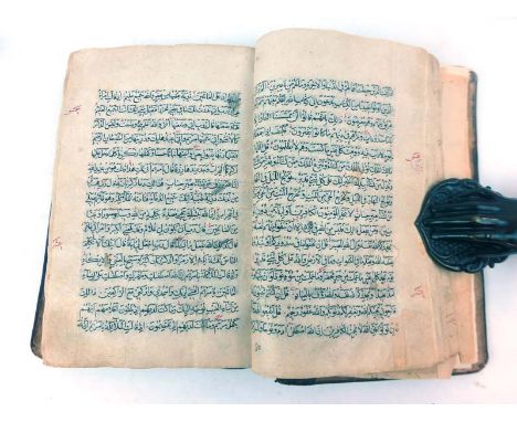 Qur'an  : A 19th.C ( possibly late 18th.C ) 8vo sized manuscript copy of the Qur'an, in a binding composed of brown glazed pa