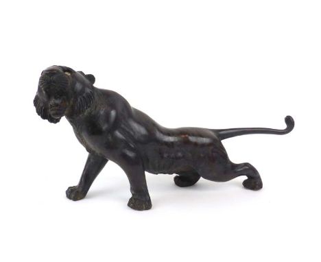 A Japanese brown patinated bronze figure modelled as an outstretched tiger, signed, l. 37.5 cm CONDITION REPORT: For conditio
