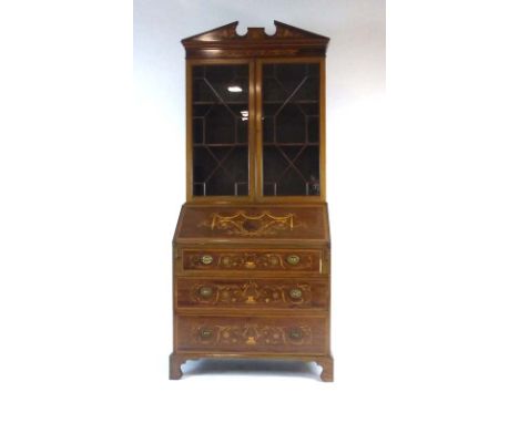 An Edwardian Sheraton Revival mahogany, satinwood crossbanded and marquetry bureau bookcase, the pair of glazed doors below a