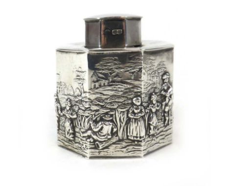 An early 20th century silver tea caddy of octagonal form repousse decorated with figures in a countryside setting, maker GN R