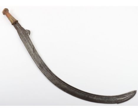 Zande Mambeli War Scimitar from North East Zaire, curved double edge blade with raised and geometrically chiselled central re