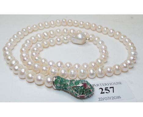 A silver, emerald, ruby and pearl necklace, the clasp in the form of a snake