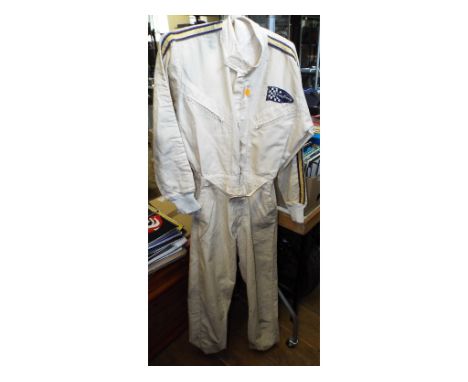 A period 1960s Paddy Hopkirk fire retardant race overalls, with embroidered Good Year patch to the left hand breast pocket, a